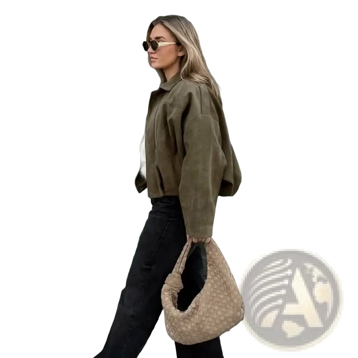 Beige woven wicker handbag with distinctive knot handle paired with olive green suede bomber jacket