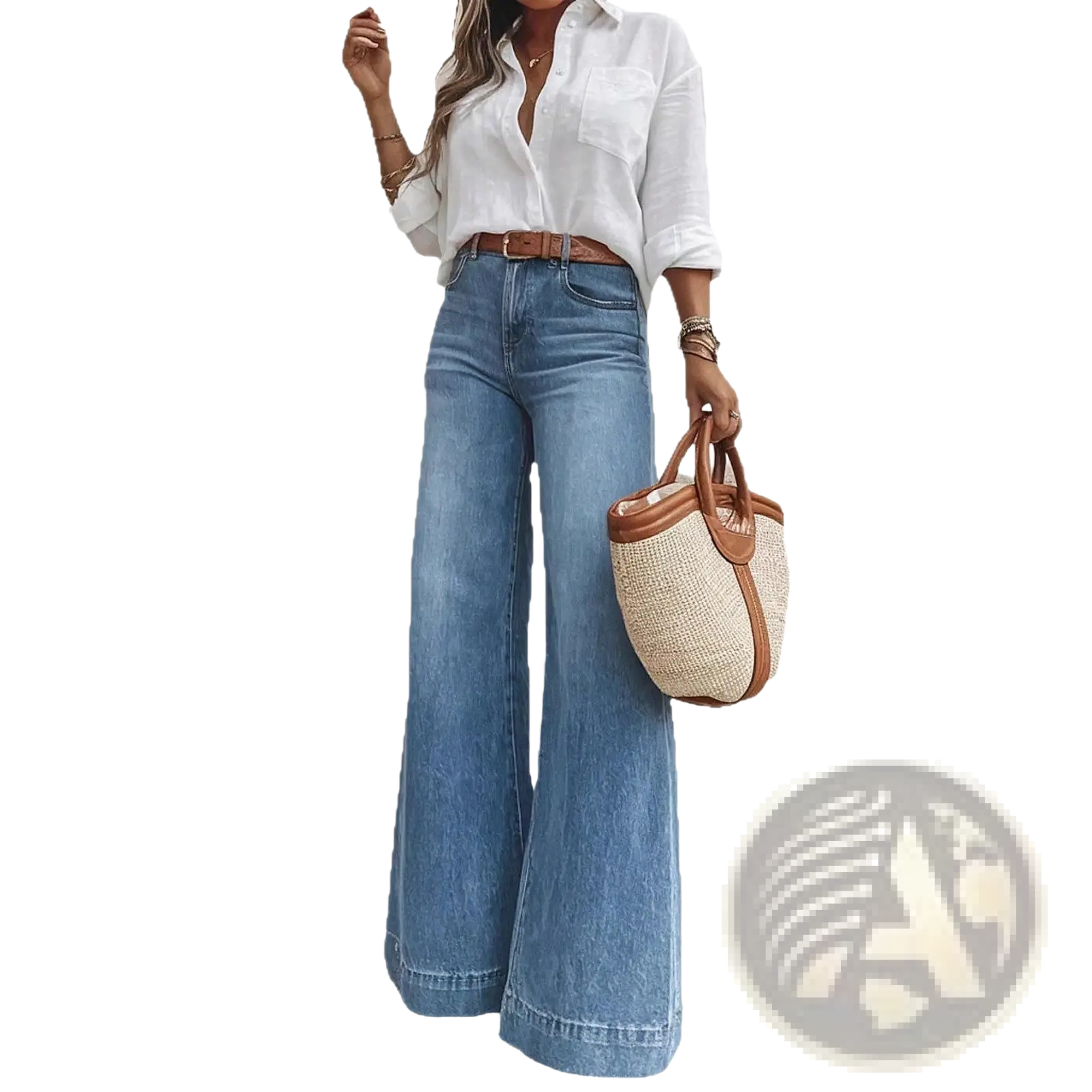 A woven straw tote bag with brown leather handles and trim paired with olive green wide leg denim jeans