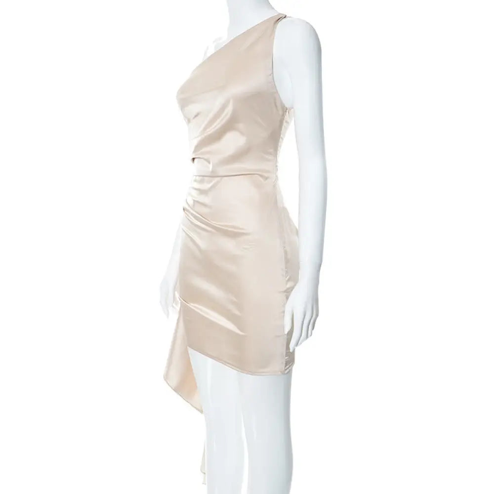 Beige satin ruched one shoulder backless mini dress with asymmetrical hemline shown from the back side