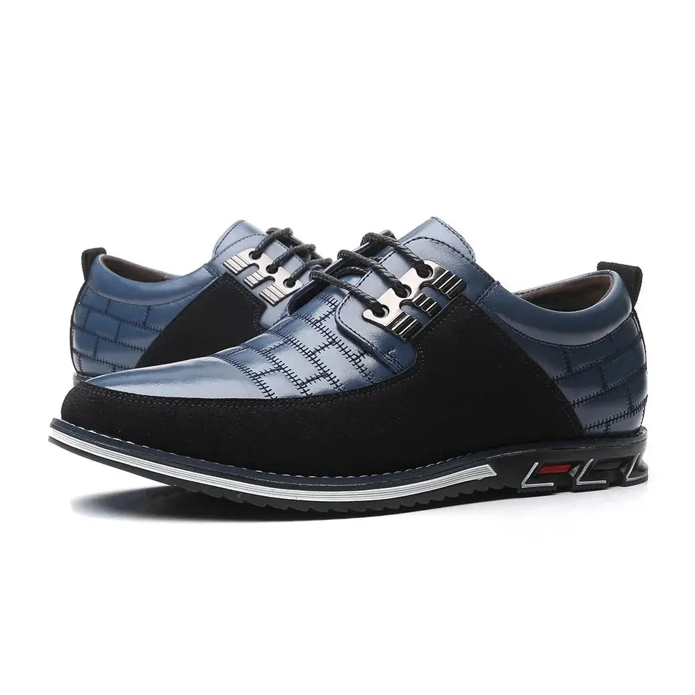 Men’s British two-tone blue and black leather dress shoes with quilted panels, metallic eyelets, and textured sole