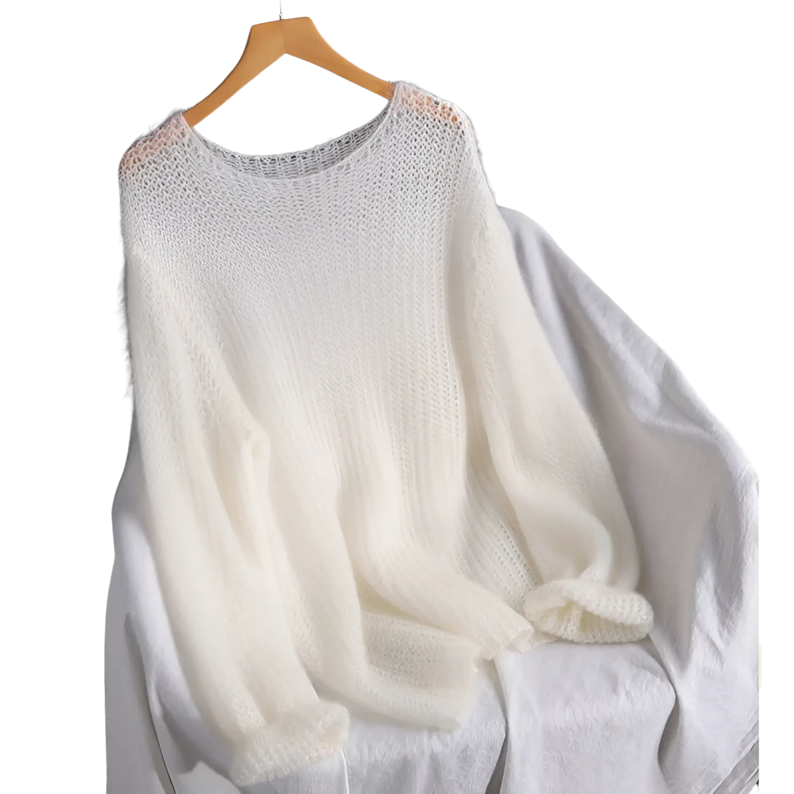 Open knit pullover blouse style knit top in soft off white with loose airy texture and ribbed cuffs on wooden hanger