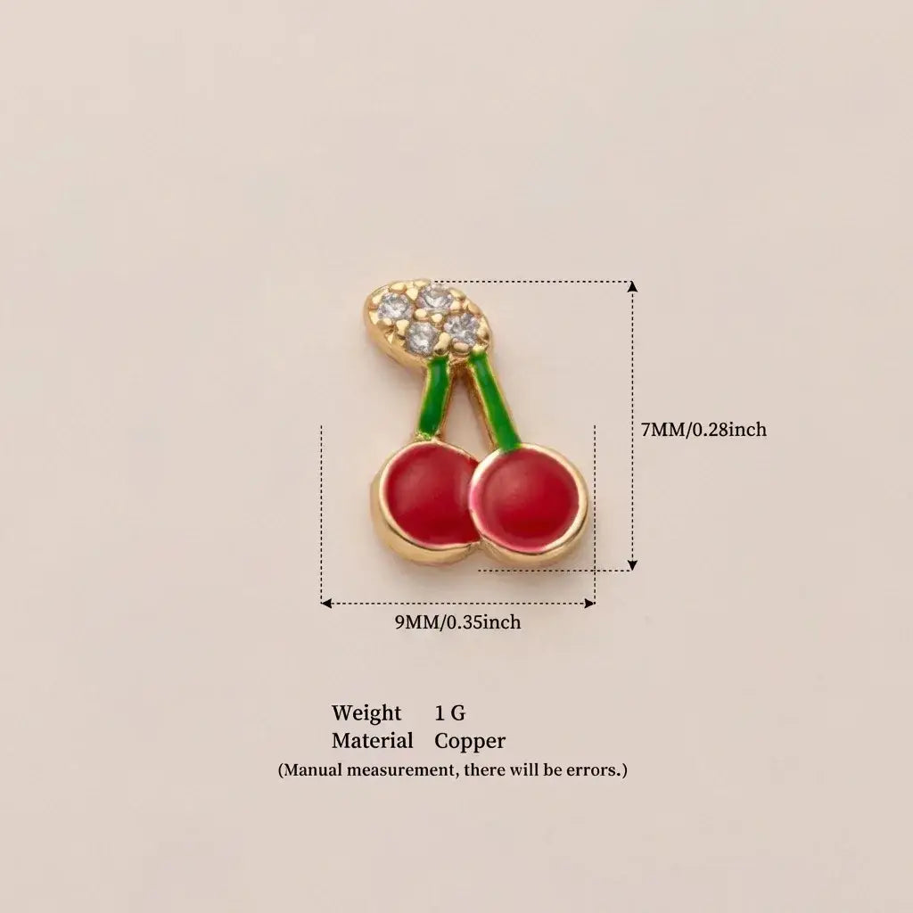 A shiny red cherry-shaped enamel pin with gold-tone frame and rhinestones complements women girls simple fashion accessories