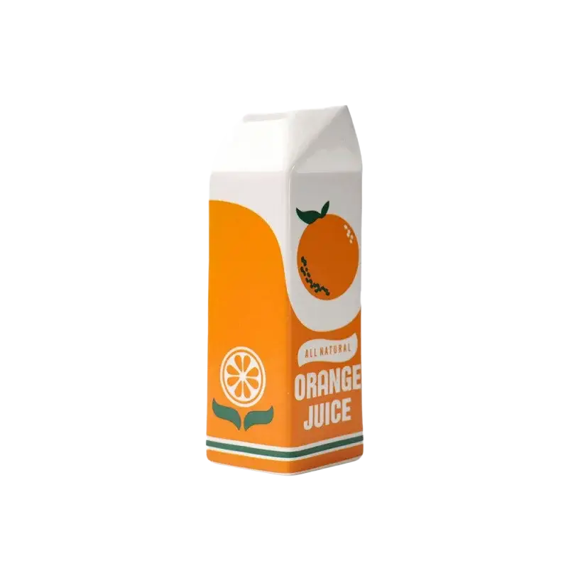 A white and orange ceramic vase shaped like an all natural orange juice carton with a green stripe at the bottom