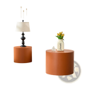 Orange cylindrical side table with a smooth matte finish and rounded edges from the orange saddle leather round coffee table set