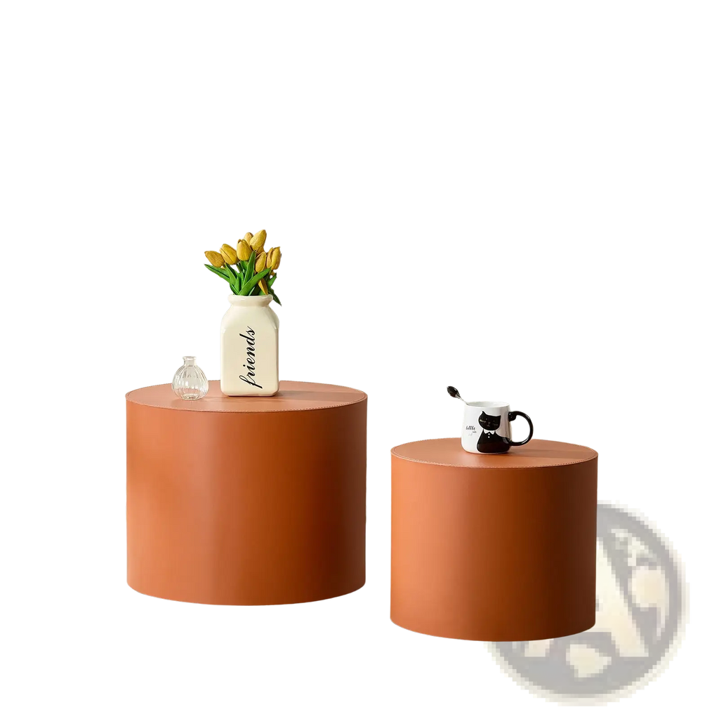 Two matte orange cylindrical coffee tables with a modern minimalist design in orange saddle leather round coffee table set