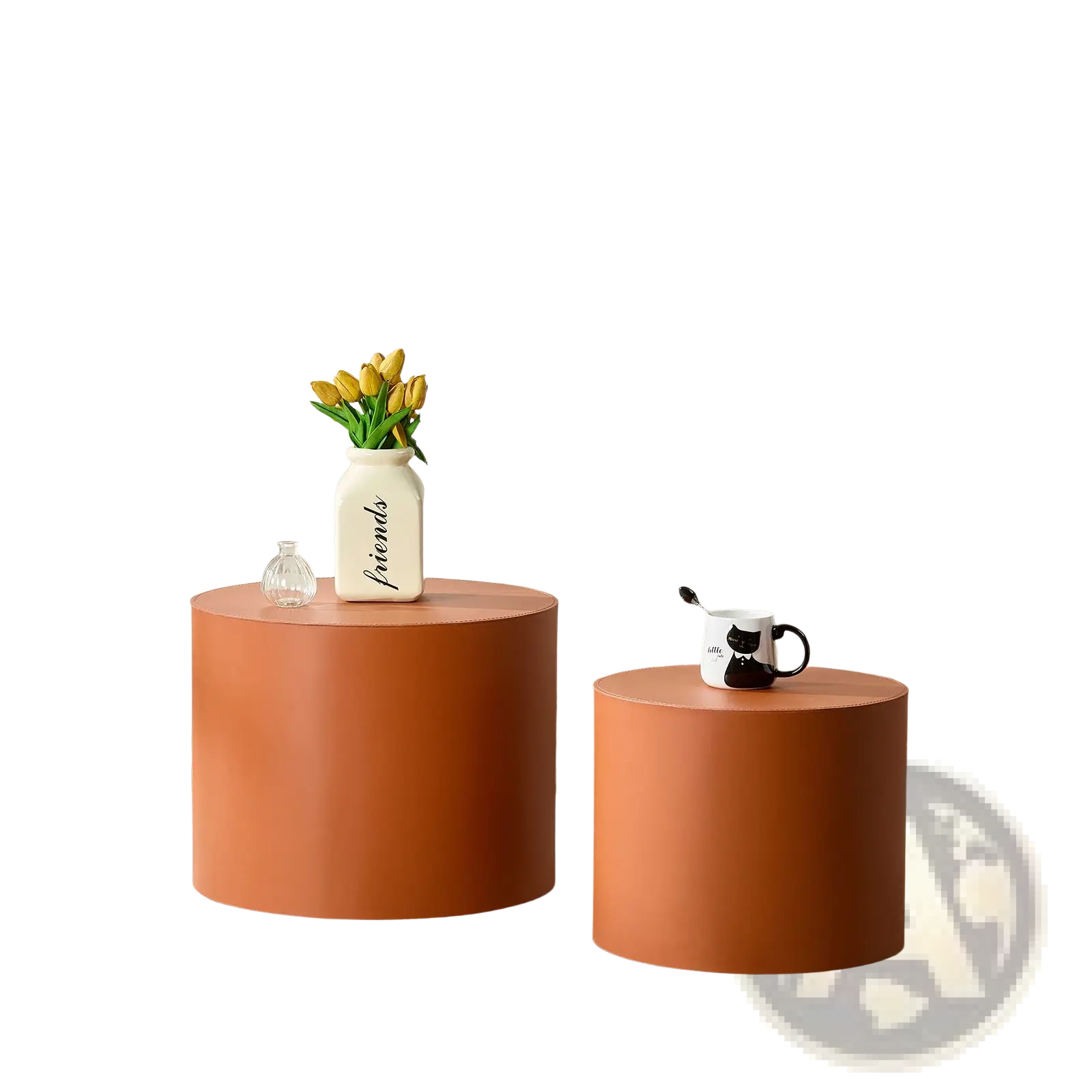 Two matte orange cylindrical coffee tables with a modern minimalist design in orange saddle leather round coffee table set