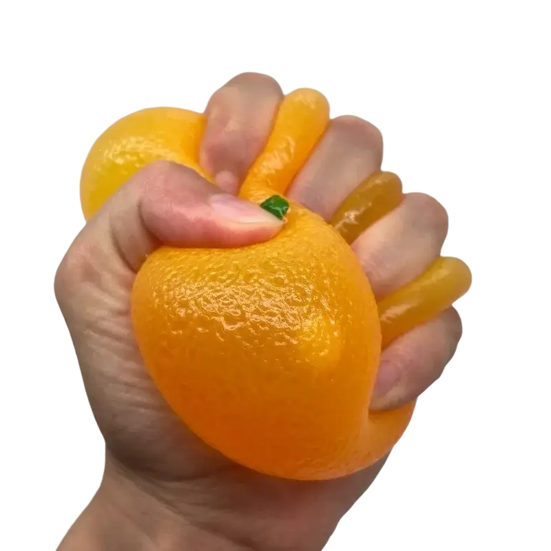 Orange silicone stress ball sensory fidget toy shaped like a textured citrus fruit with a small green stem