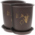 Dark brown ceramic orchid pots with gold-leaf designs and chinese calligraphy paired with matching plant nursery pots trays