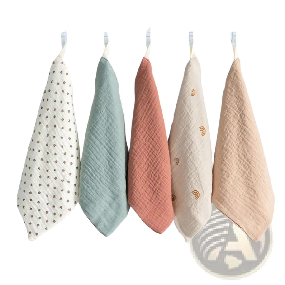 Organic cotton baby bath towel and muslin set with five pastel textured muslin cloths on a white rack