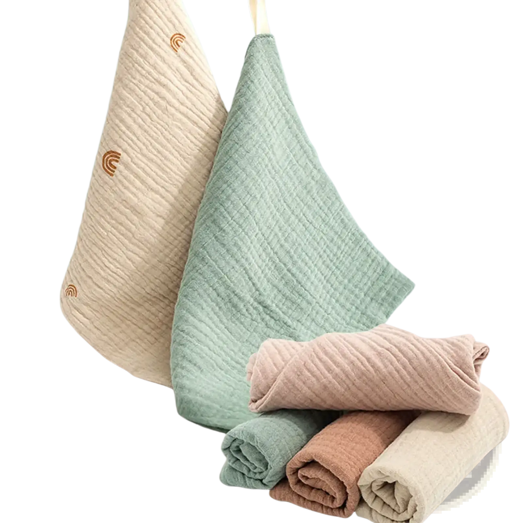 Organic cotton baby bath towel and muslin set with soft pastel colors ribbed texture and small rainbow embroidery