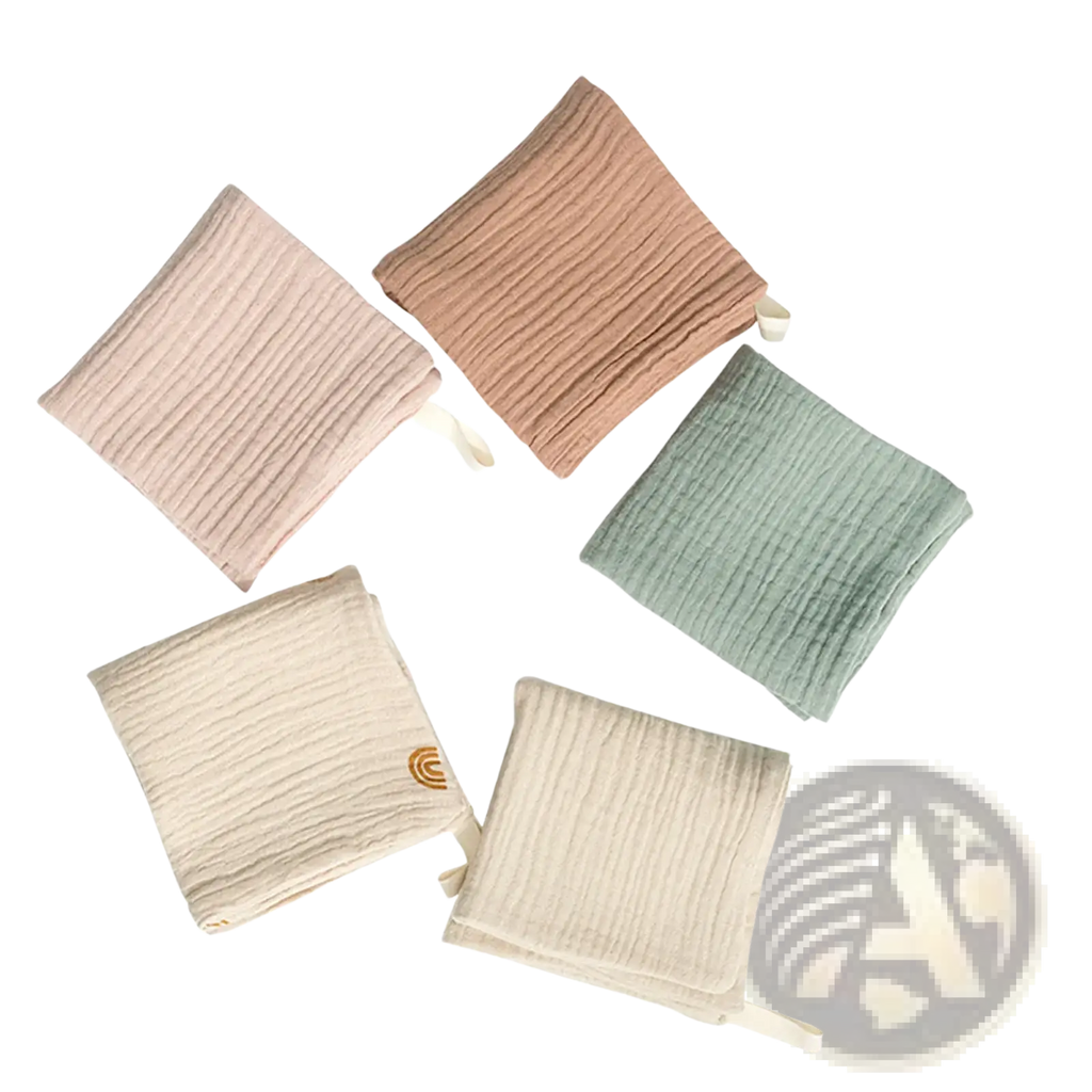 Organic cotton baby bath towel and muslin set in soft pastel colors with subtle ribbed texture and small fabric ties