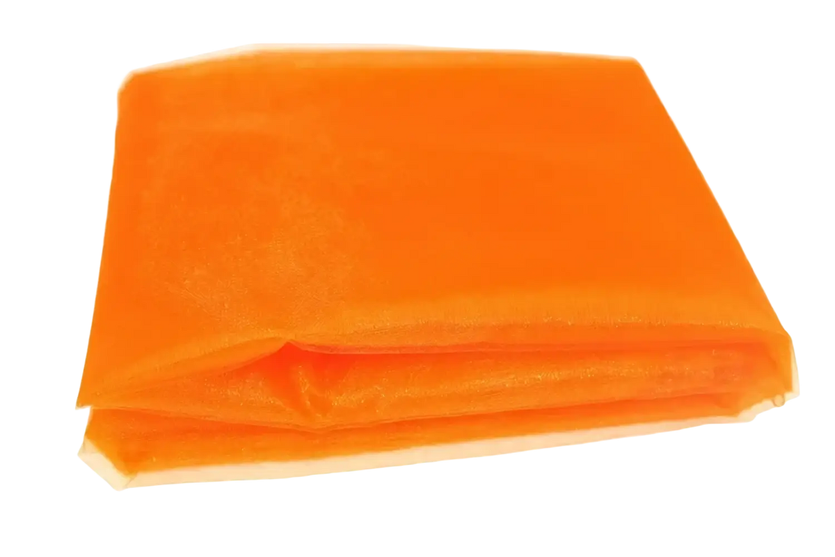 A folded piece of vibrant orange organza fabric with fine semi-transparent mesh texture for diy decor roll 70cm width