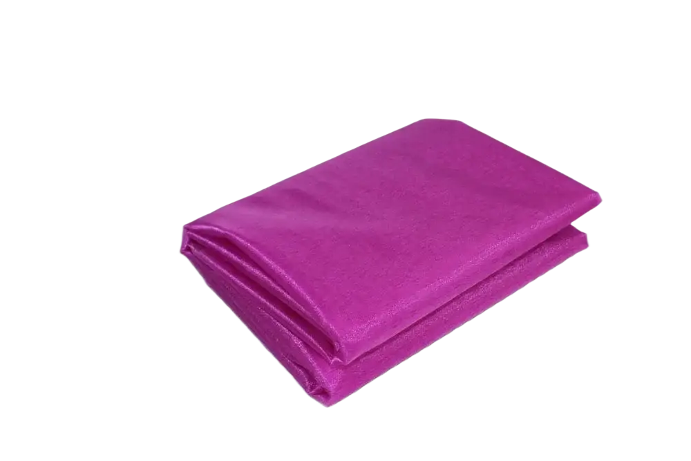 A vibrant magenta satin napkin neatly folded as part of organza fabric 70cm width diy decor roll product