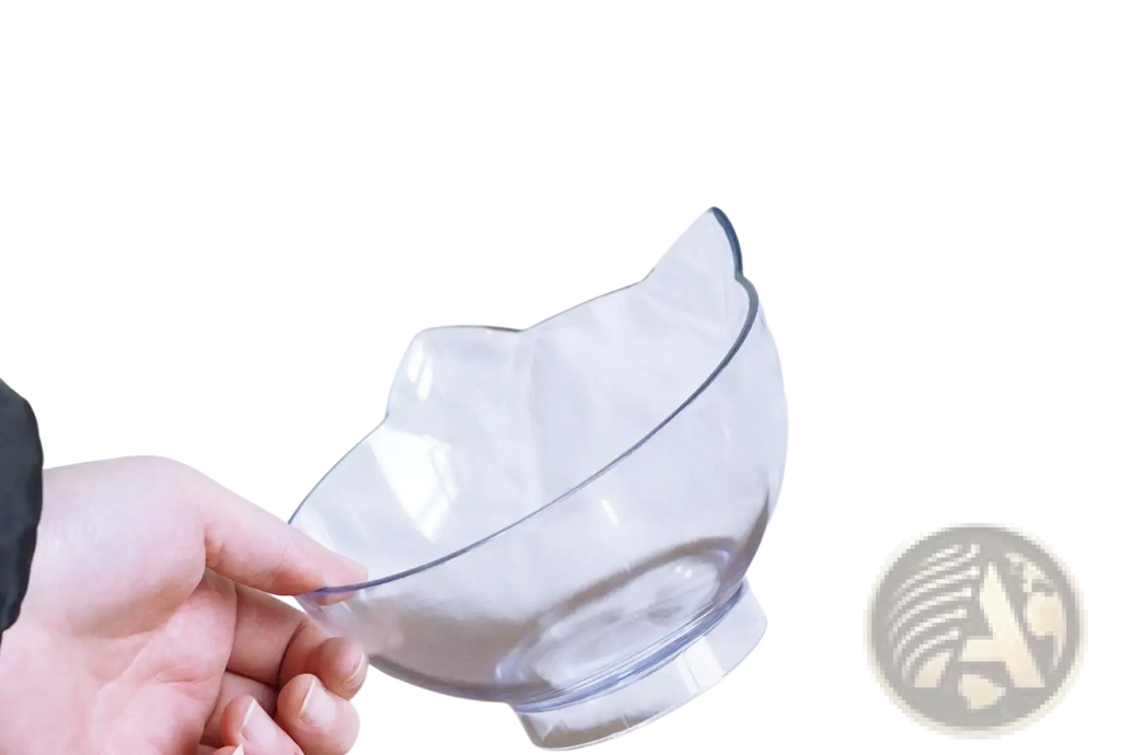Clear plastic orthopedic pet bowl with cat-shaped rim and base designed for slanted neck protection