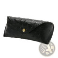 Black ostrich leather eyeglass case with gold hexagonal clasp designed for polka dot sunglasses