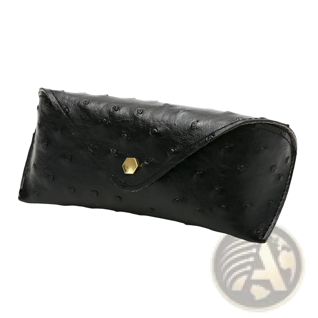 Black ostrich leather eyeglass case with gold hexagonal clasp for storing polka dot sunglasses