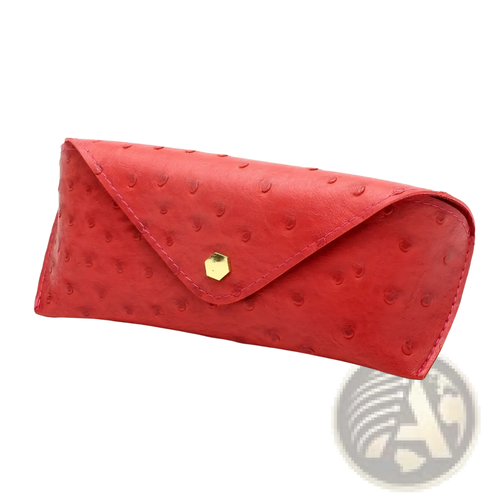 Red ostrich leather sunglasses case with gold hexagonal clasp featuring polka dot design