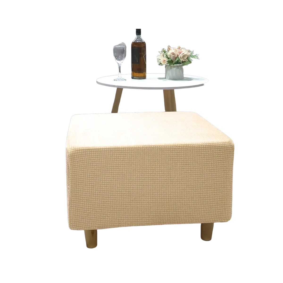 Beige textured fabric ottoman slipcover with stretch elastic fit displayed on footrest with wooden legs