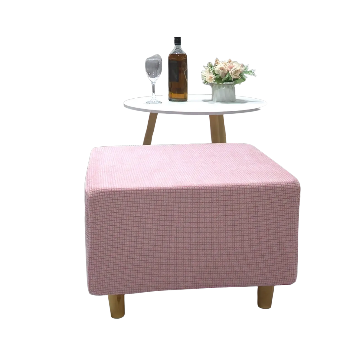 Pink textured fabric ottoman with wooden legs featuring a stretch elastic slipcover for footrest protection