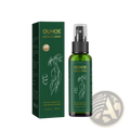 Green glass spray bottle with black pump labeled Ouhoe natural herbs next to matching box for hair growth serum spray
