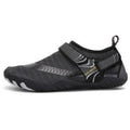 Lightweight cut resistant five finger outdoor wading shoe in black and gray mesh with strap closure and white sole accents