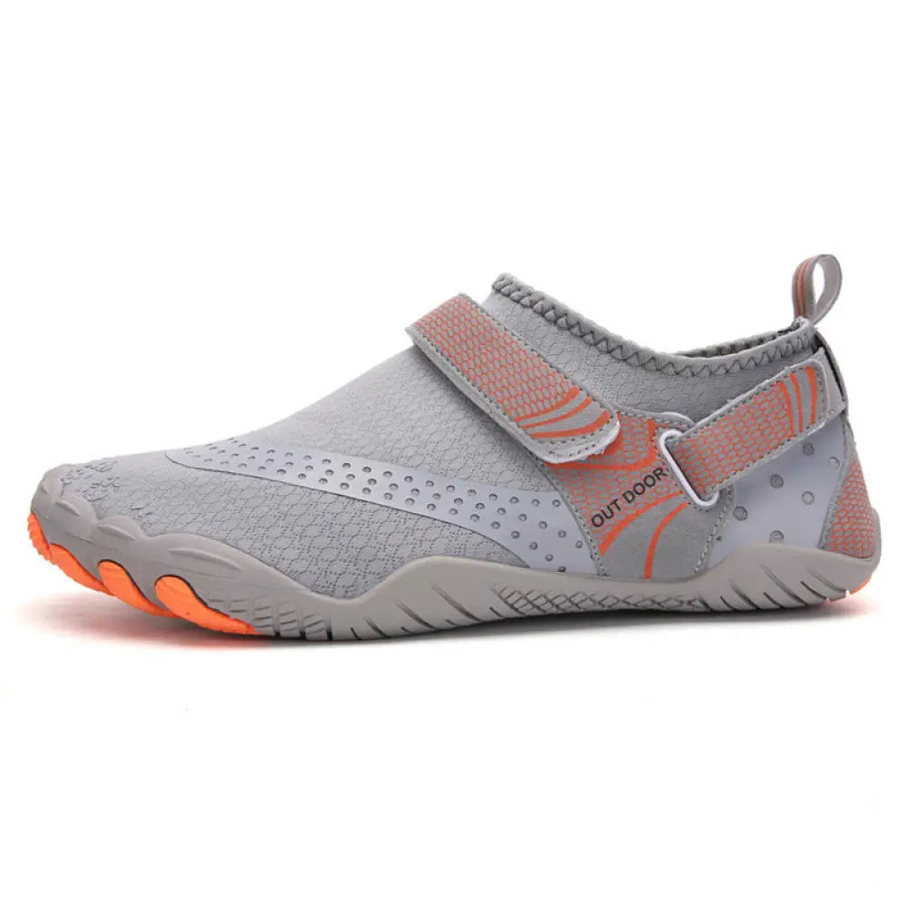 Lightweight cut resistant five finger outdoor wading shoe in gray and orange with mesh upper velcro strap and rubber sole