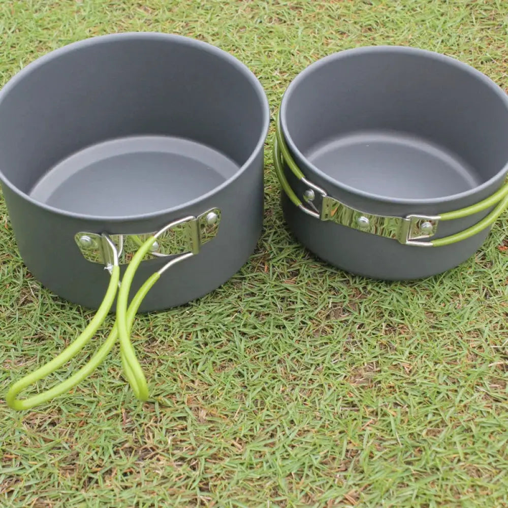 Gray aluminum non stick camping pots with green silicone handles and silver clasps from Arbaglobal 10 piece set