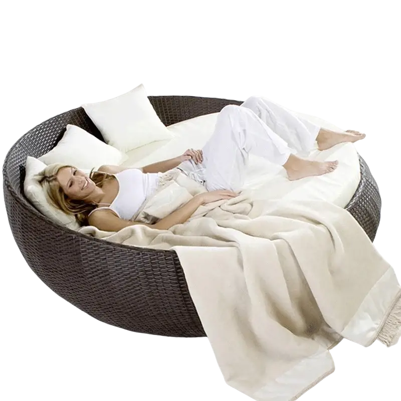 Dark brown woven wicker outdoor rattan round daybed with canopy white cushions and cream throw blanket width 750px height