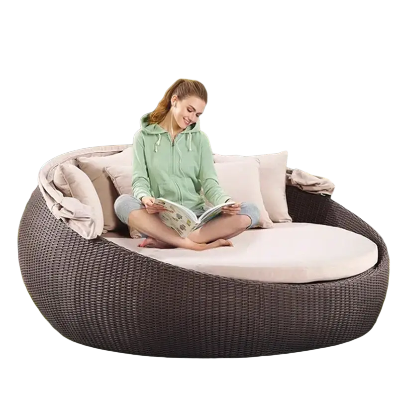 Dark brown woven wicker outdoor rattan round daybed with beige cushions and white mattress width 750px height