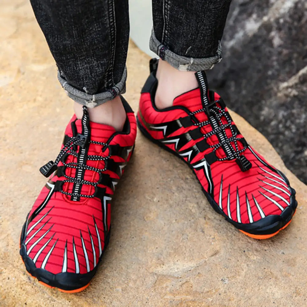 Breathable five finger quick dry water sports shoes in red and black with white lightning bolt accents and orange soles