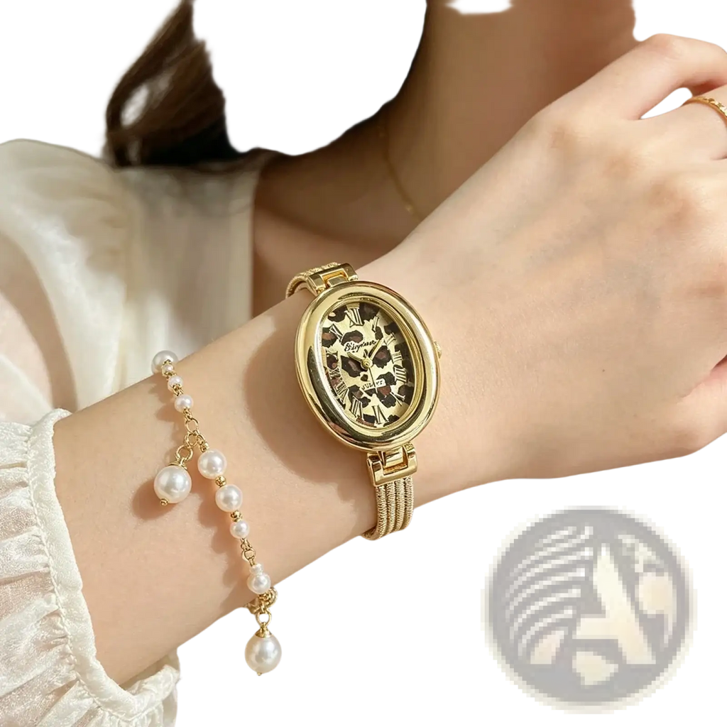 Gold-toned oval quartz women watch with leopard print face and roman numerals paired with matching pearl bracelet