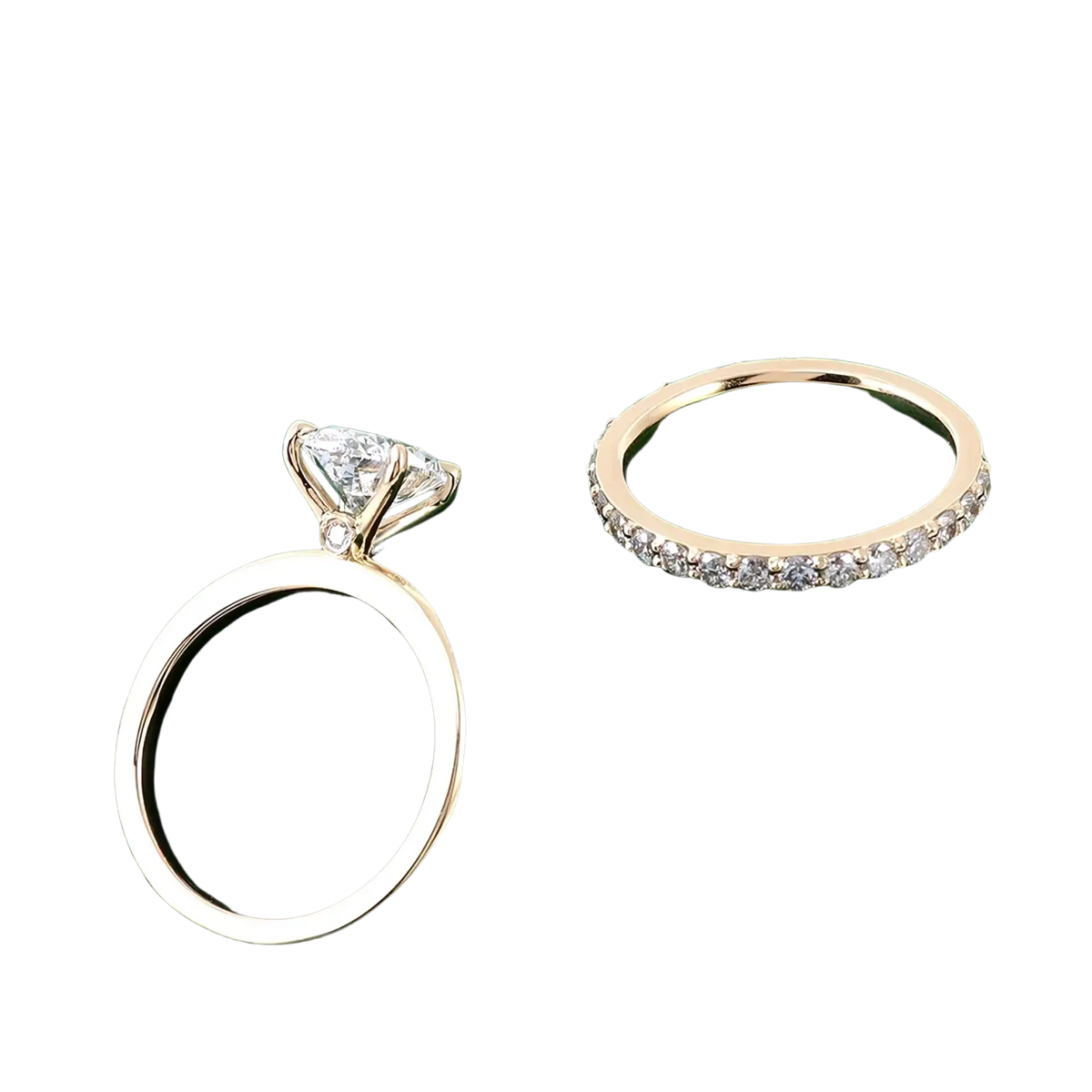 Oval lab diamond bridal set gold featuring a gold engagement ring with central and accent diamonds and a pavé eternity band