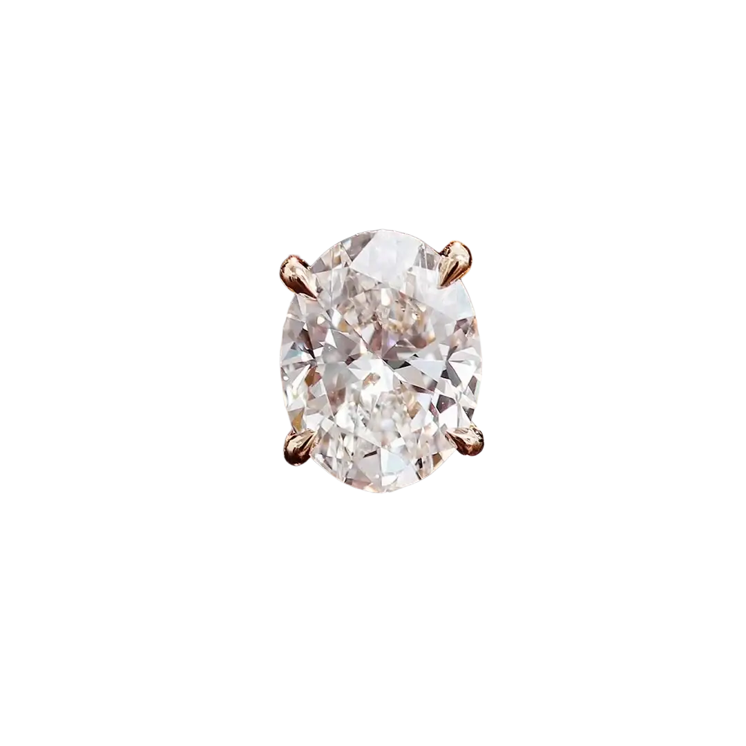Oval lab diamond bridal set featuring a radiant oval-cut diamond engagement ring with gold band and matching wedding bands