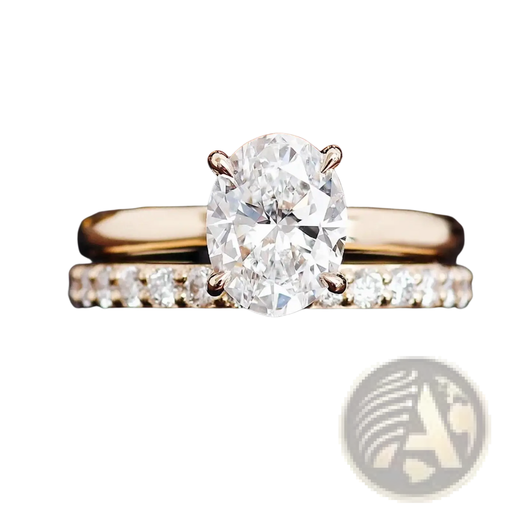 A radiant oval lab diamond bridal set in yellow gold featuring an engagement ring and pave diamond wedding band