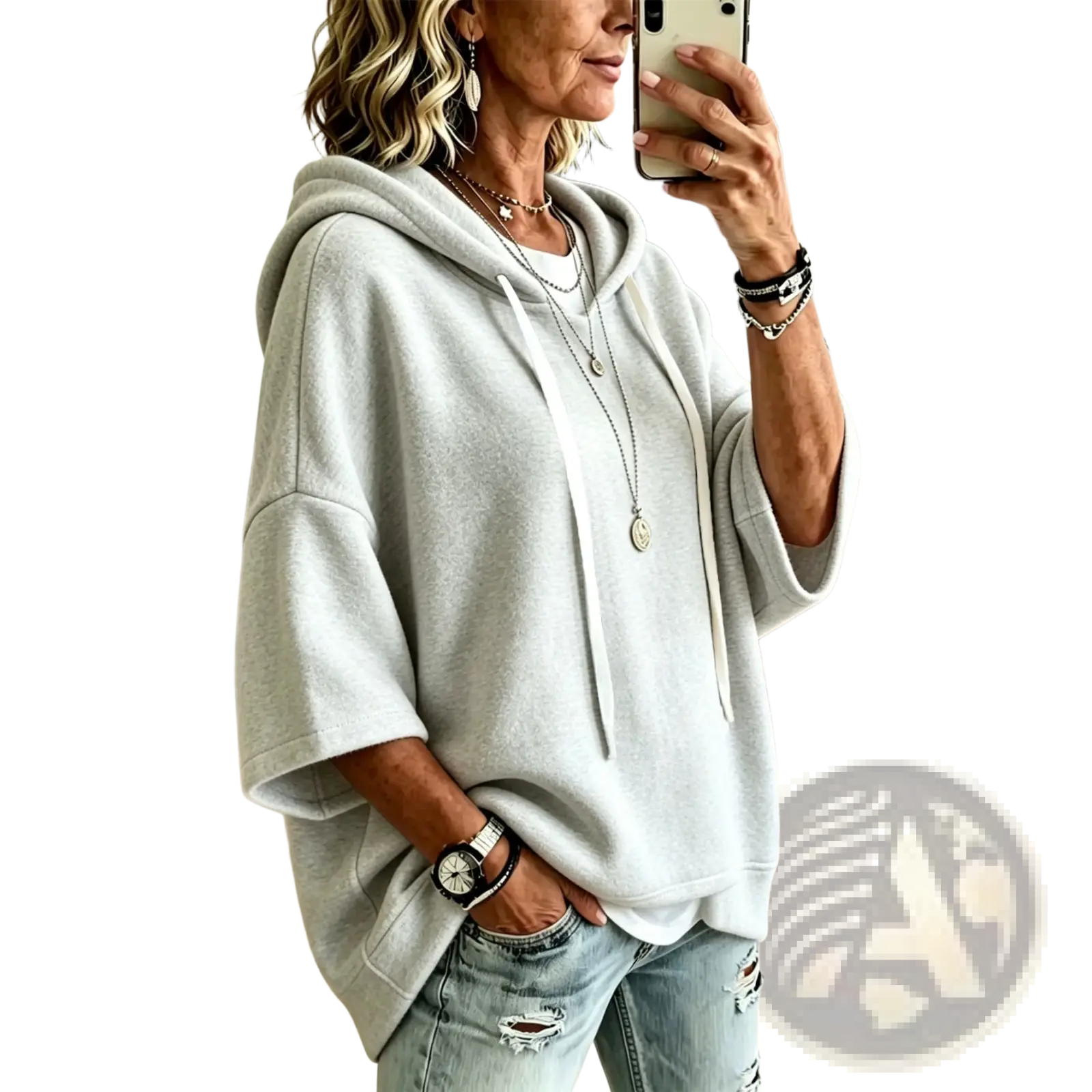 A soft light gray oversized fleece hooded top with three-quarter sleeves and a relaxed fit with drawstring hood