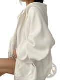 White oversized fleece zip hoodie with puffy sleeves and soft plush fabric texture, front view