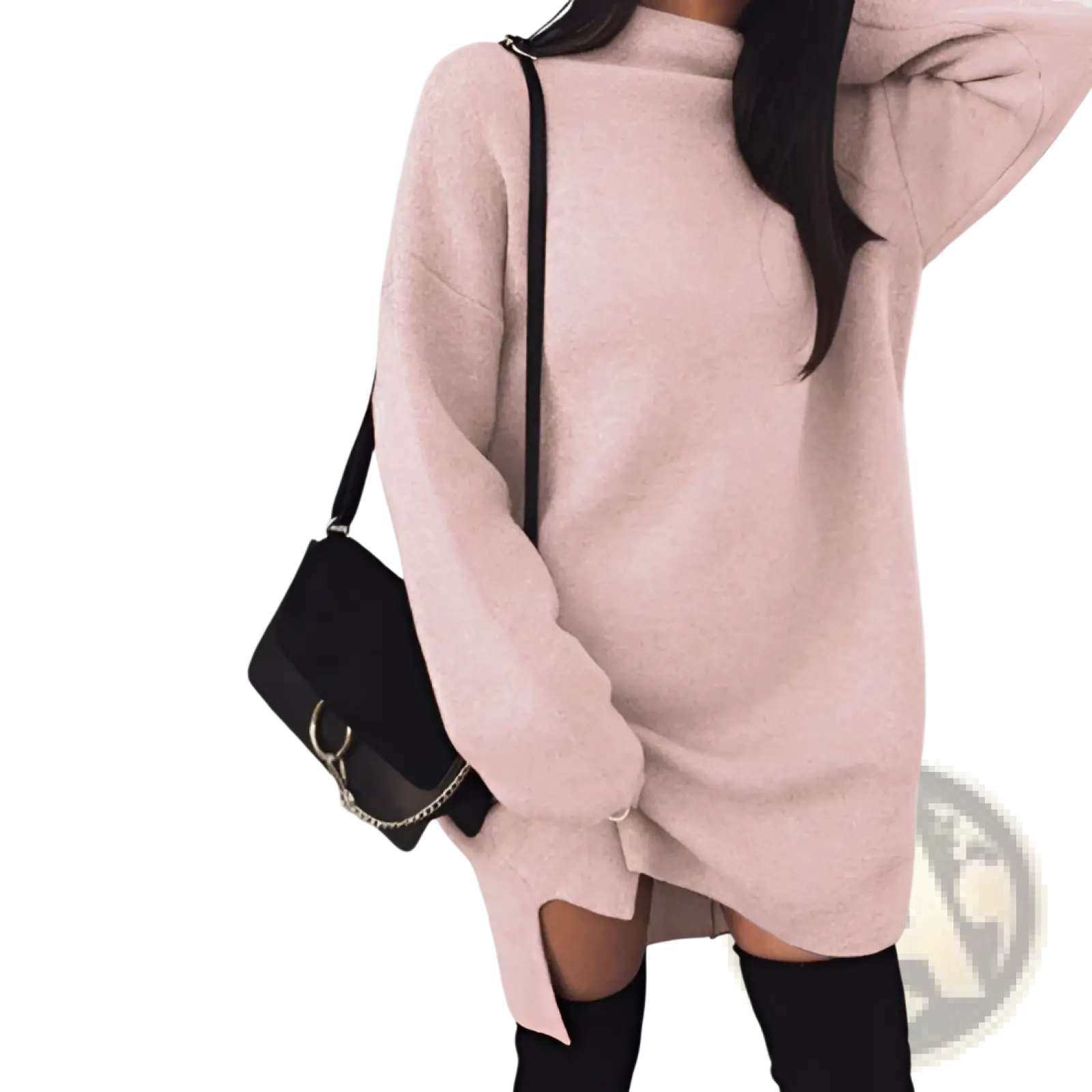 A soft pink oversized knit sweater dress with a high neckline and side slits in a cozy knit material