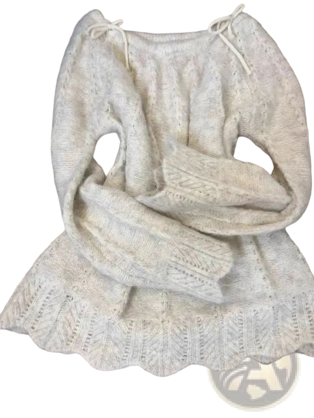 A cream-colored knitted oversized sweater with scalloped hem and drawstring ties in korean winter fashion