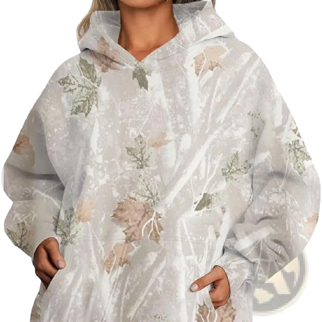 A soft oversized white hoodie with muted green and brown leaf pattern and lantern sleeves for casual wear
