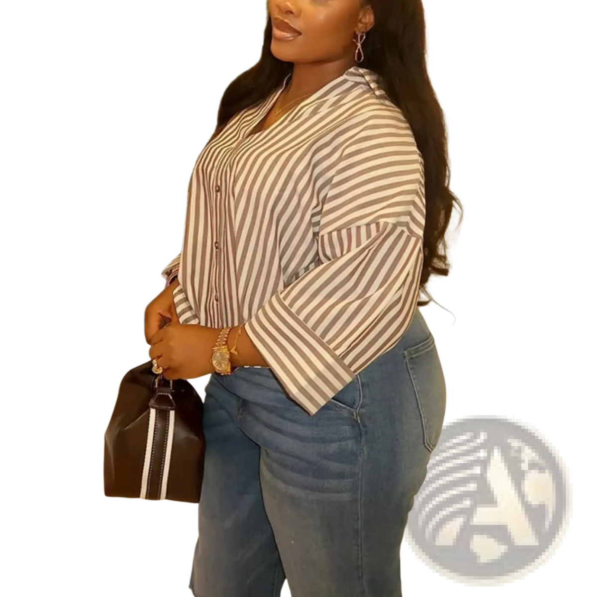 Brown bucket bag with white vertical stripes and black handle paired with oversized linen blend bell sleeve blouse