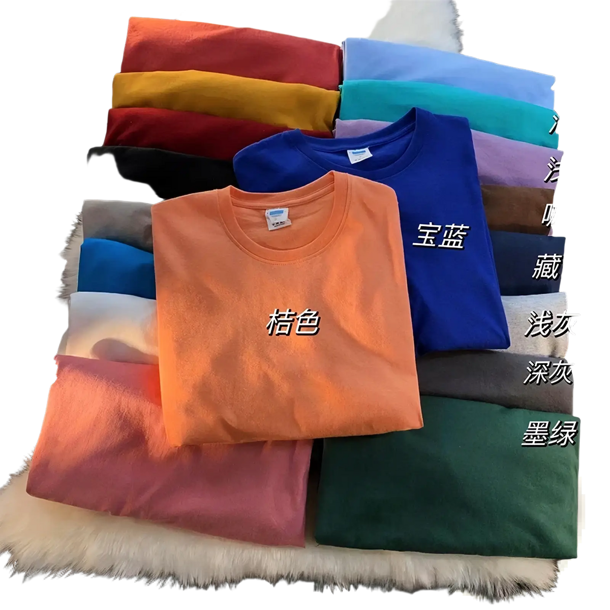 A neatly folded orange cotton oversized long sleeve blank t-shirt with a classic crew neck and short sleeves among solid colors