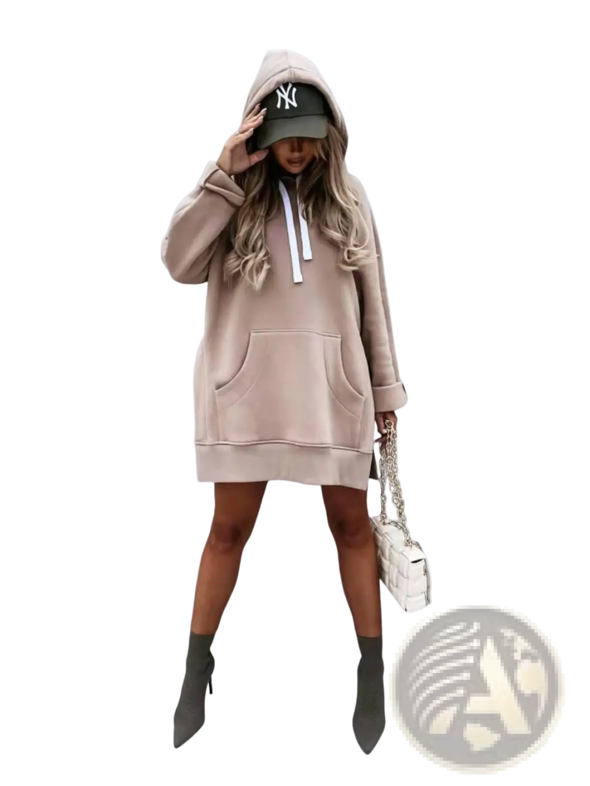 Beige oversized mid length hooded sweatshirt dress with front pockets and white drawstrings worn over green baseball cap