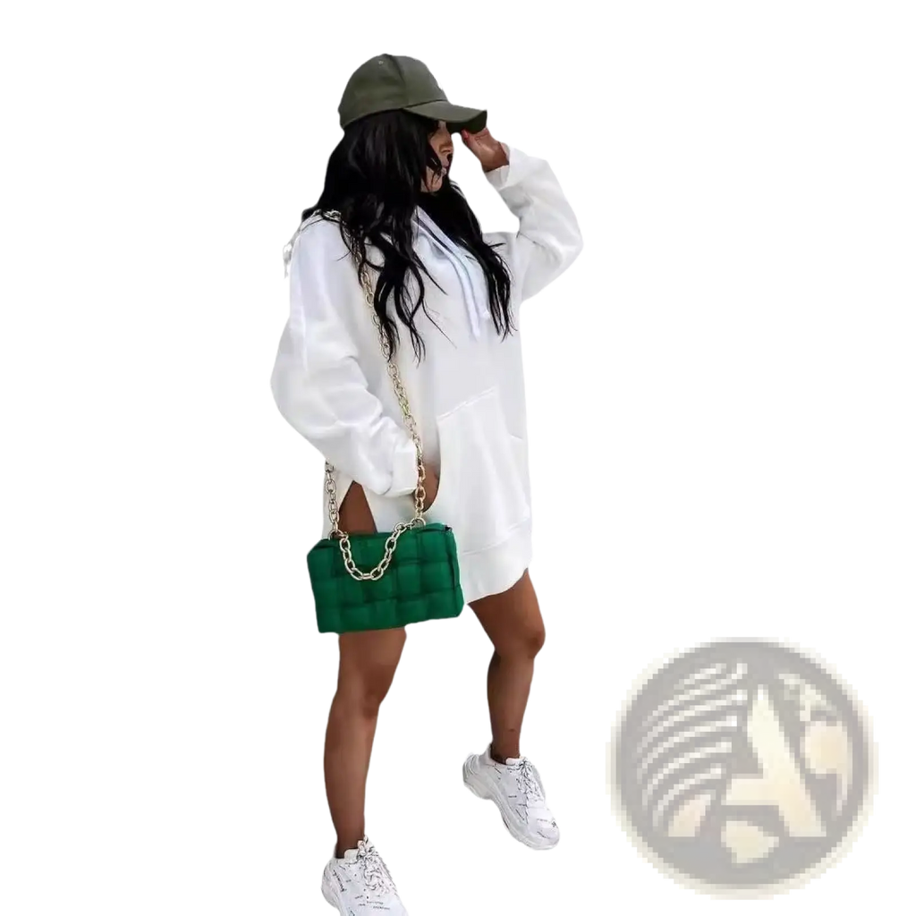Green quilted leather chain strap handbag paired with oversized mid length hooded sweatshirt dress with pockets