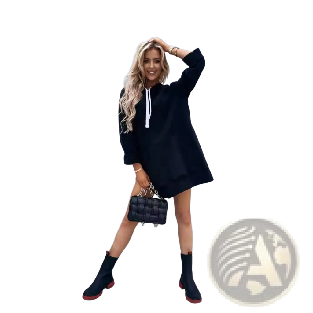 Black quilted handbag with silver chain strap paired with oversized mid-length hooded sweatshirt dress with pockets