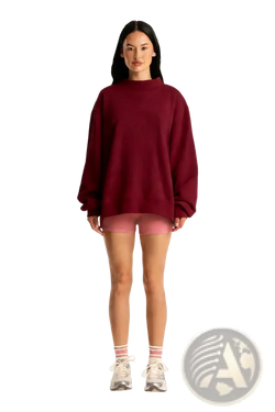 A maroon oversized fleece pullover sweatshirt with a high neckline and long sleeves displayed from the front