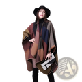 Oversized plaid woolen cape with cozy earth-toned geometric patchwork in brown rust and navy blue for travel use