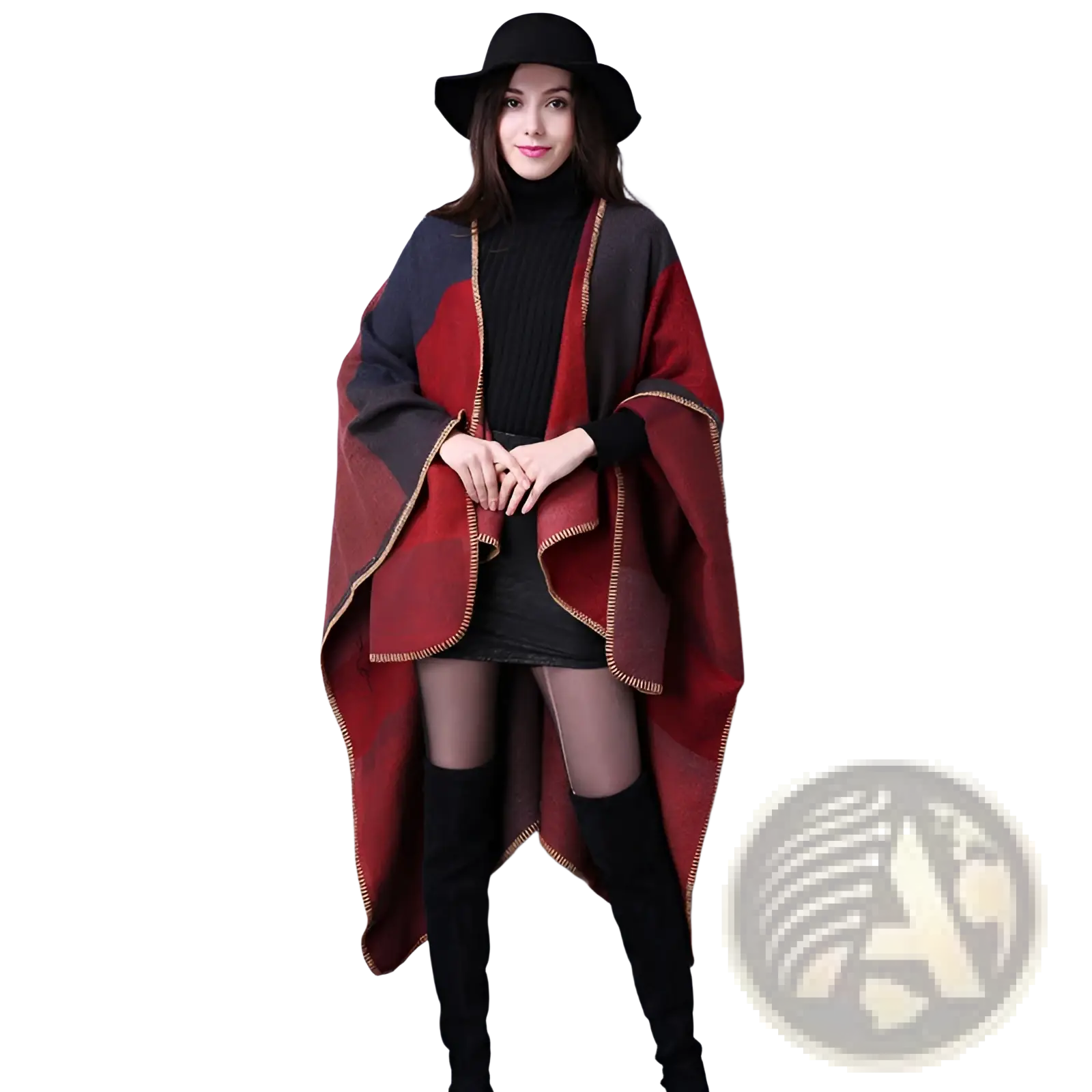 A cozy oversized red and black woolen poncho with gold-trimmed edges perfect for travel and layering