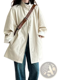 Cream-colored oversized single breasted trench coat for women with high collar and relaxed fit button-up design