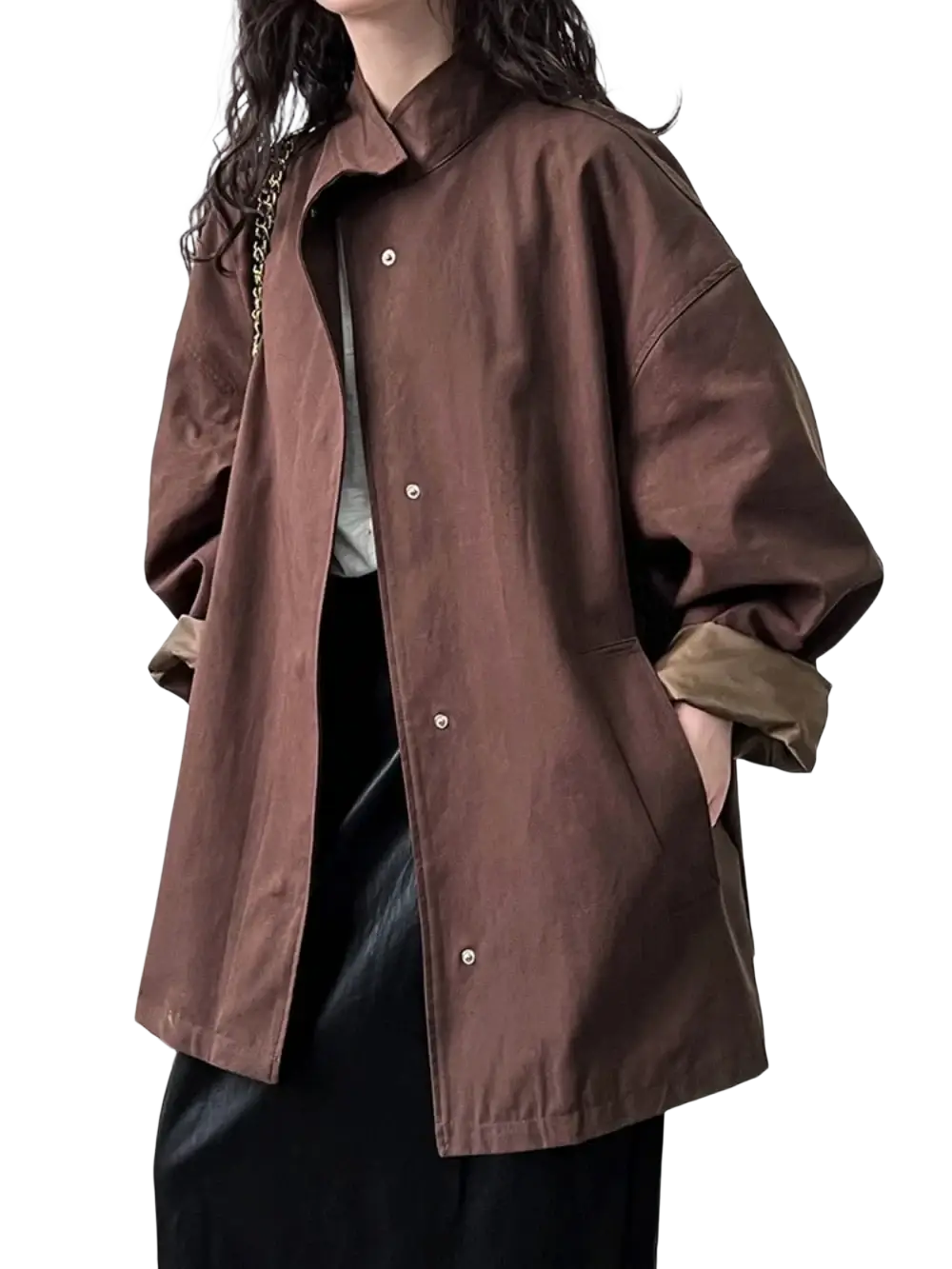 Brown oversized single breasted trench coat for women with textured fabric and contrasting lighter brown cuffs