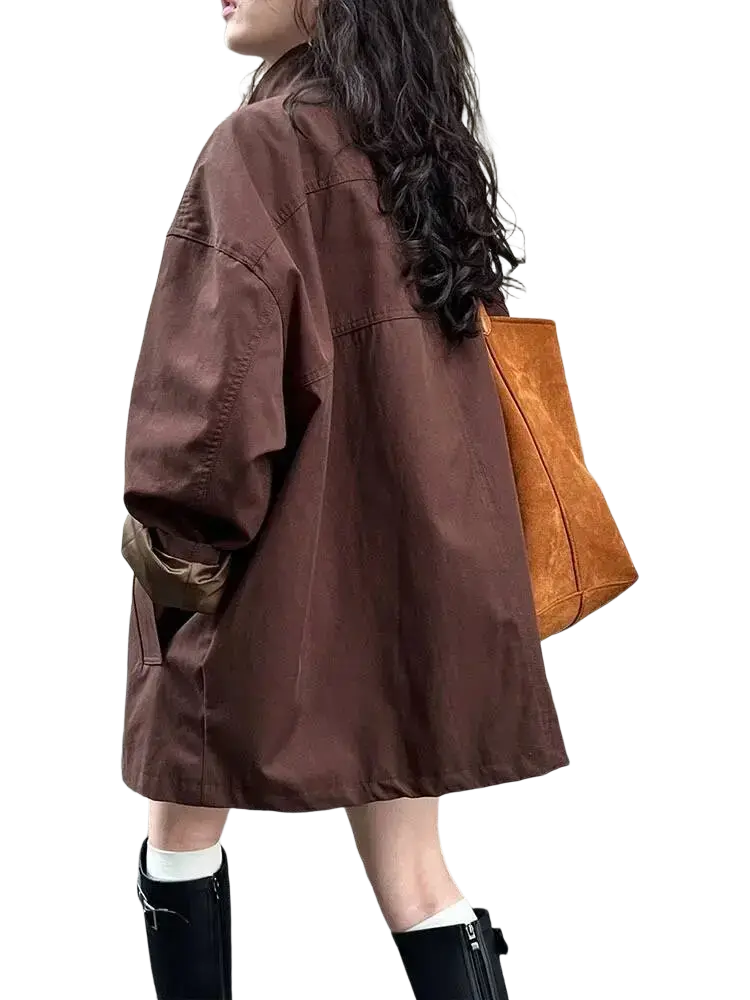 Brown oversized single breasted canvas trench coat for women with rolled up sleeves and relaxed fit